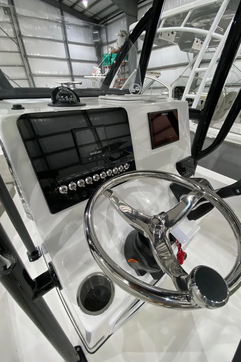 Slide: The Image of 2024 Sea Pro 202 boat dashboard with steering wheel and control panel. - 5