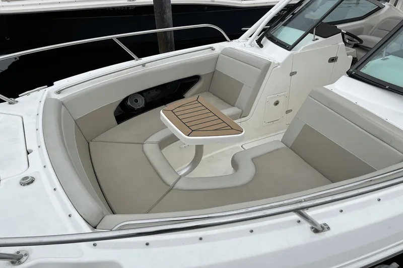 Slide: The Image of 2022 Boston Whaler 240 Vantage boat interior with seating and table. - 4