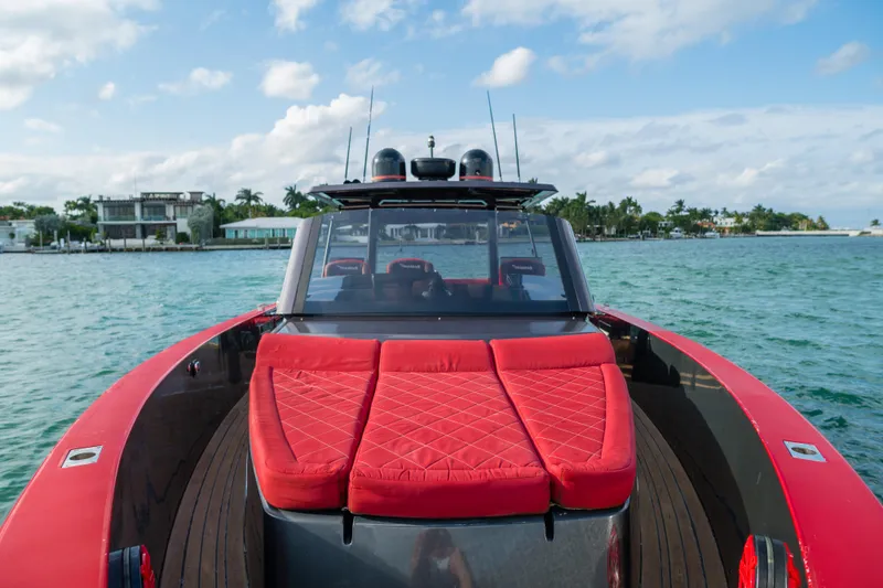The Image of Luxury 2008 Fjord Express boat with red seating, cruising on clear blue waters. - 0