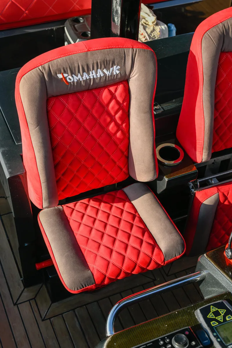Slide: The Image of Red and gray quilted boat seat on 2008 Fjord Express. - 10