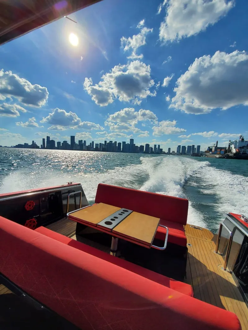 Slide: The Image of 2008 Fjord Express boat cruising with city skyline and sunny sky in the background. - 15