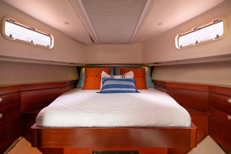 Slide: The Image of Luxurious cabin interior of 2008 Fjord Express yacht with cozy bed and wooden accents. - 18