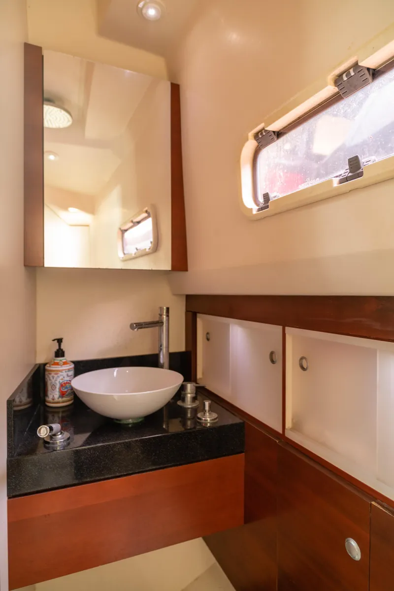 Slide: The Image of Luxurious bathroom in 2008 Fjord Express boat with modern sink and wooden cabinetry. - 21