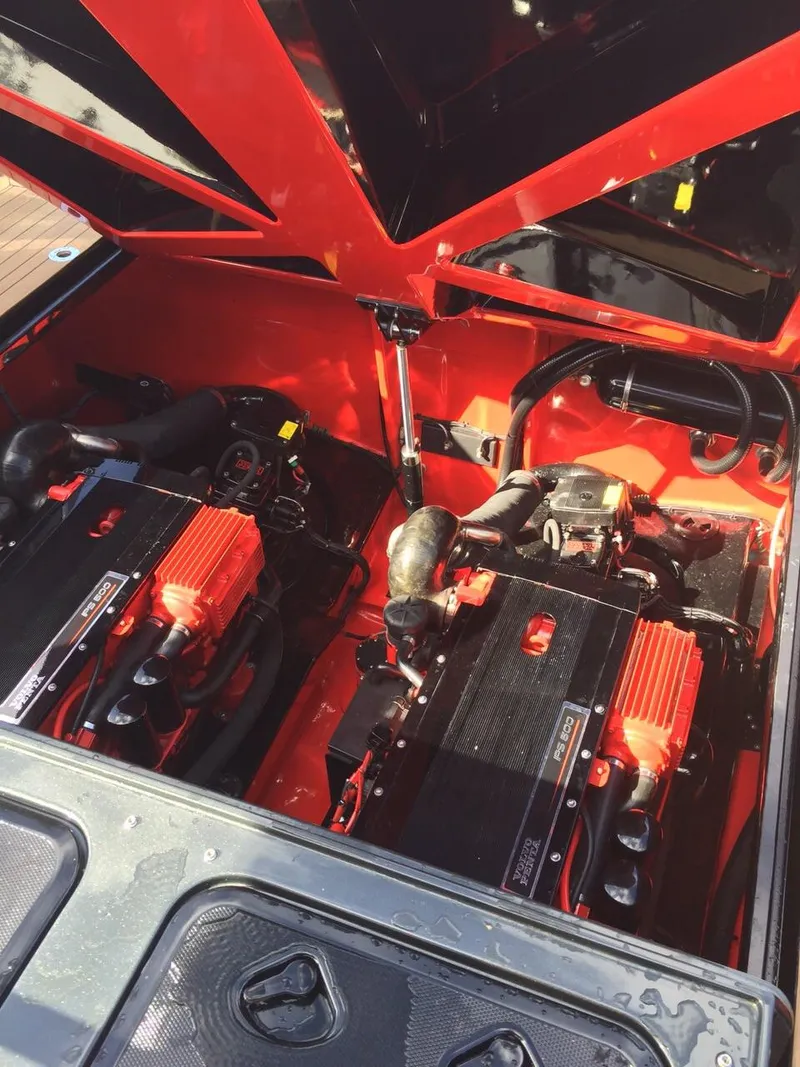 Slide: The Image of Engine compartment of a 2008 Fjord Express boat, showcasing dual engines and red accents. - 22