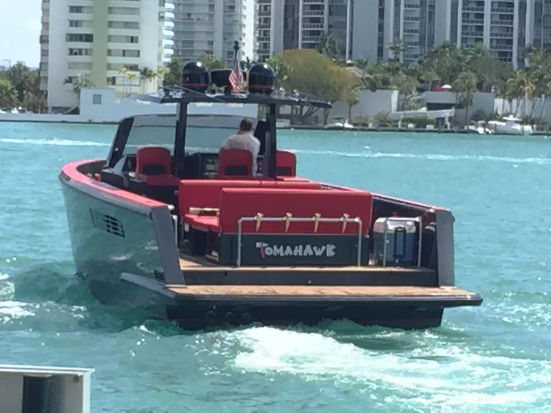 Slide: The Image of Luxury Fjord Express 2008 boat cruising on turquoise water near cityscape. - 4