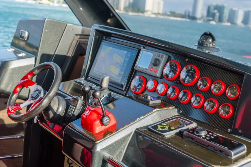 Slide: The Image of Control panel of a 2008 Fjord Express boat with gauges and navigation screen. - 9