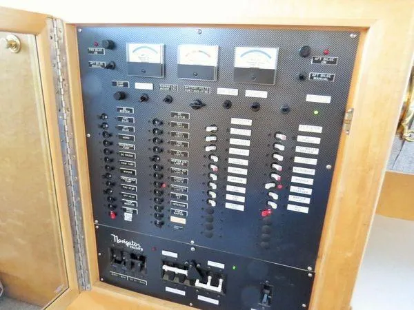 Slide: The Image of Electrical control panel of a 2000 Navigator 5300 boat, featuring gauges and switches. - 29