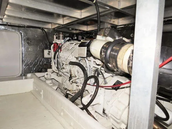 Slide: The Image of Engine room of 2000 Navigator 5300 yacht, showcasing mechanical components and wiring. - 31