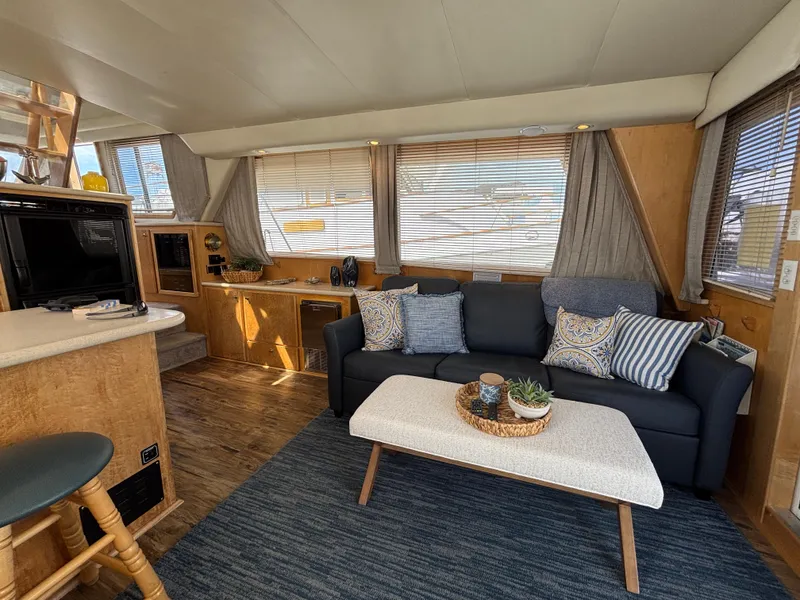 Slide: The Image of Luxurious interior of 2000 Navigator 5300 yacht with cozy seating and modern decor. - 6