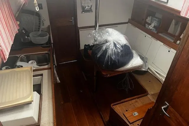 Slide: The Image of 1970 Cheoy Lee Offshore 40 yacht bathroom with sink and toilet. - 11