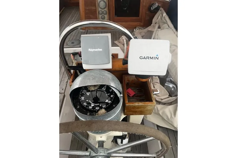 Slide: The Image of Vintage 1970 Cheoy Lee Offshore 40 boat instrument panel with gauges. - 9