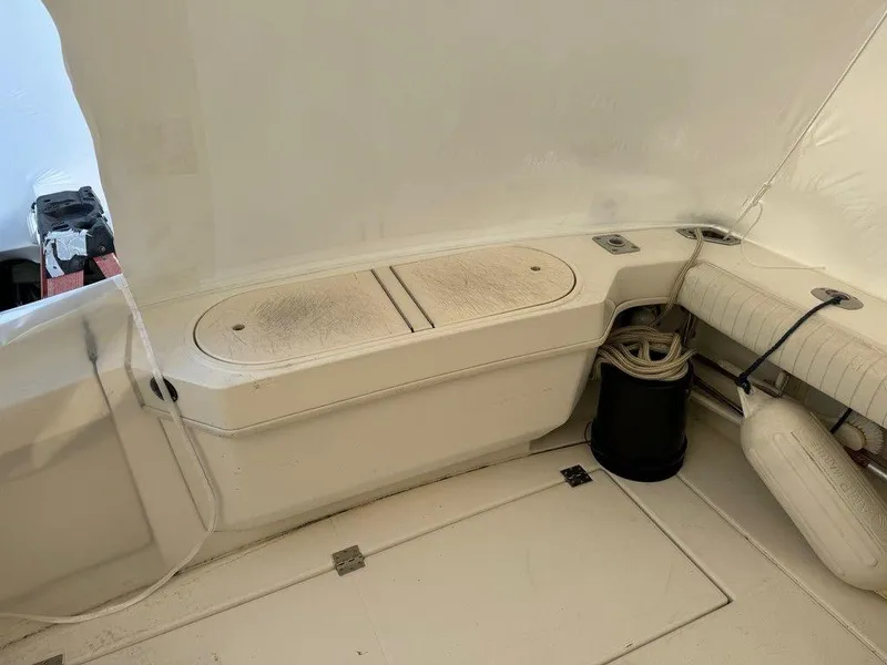 Slide: The Image of Interior of a 2000 Rampage 30 Express boat with storage compartments. - 3