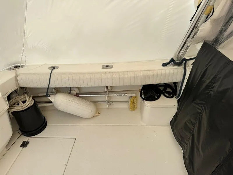 Slide: The Image of Interior of 2000 Rampage 30 Express boat with storage and seating area. - 4