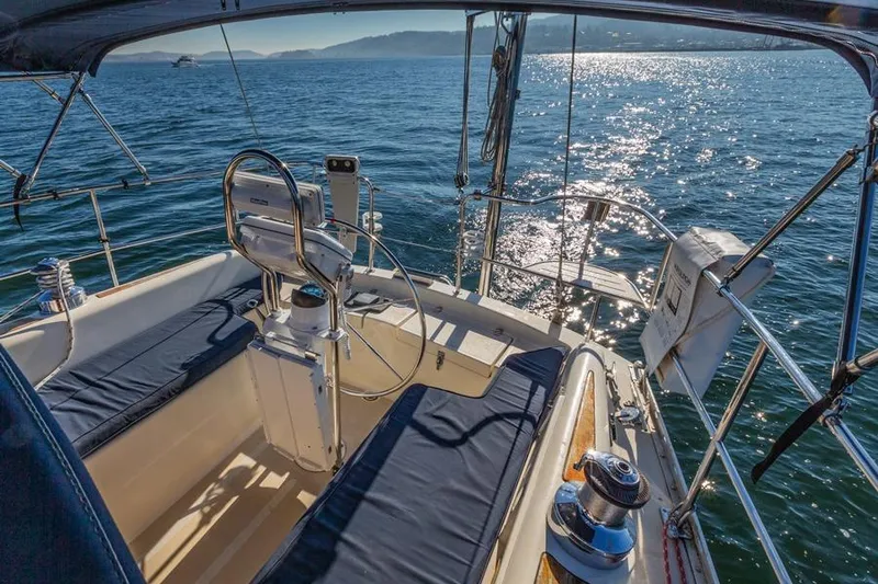 Slide: The Image of 2002 Caliber 40 sailboat cockpit with ocean view and sunny weather. - 13