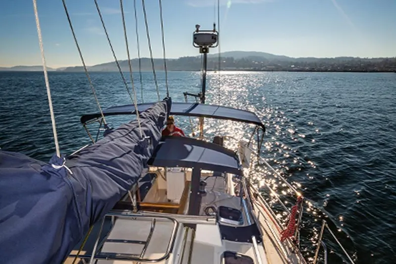 Slide: The Image of Sailing on a 2002 Caliber 40 yacht with scenic ocean view and sunny skies. - 23