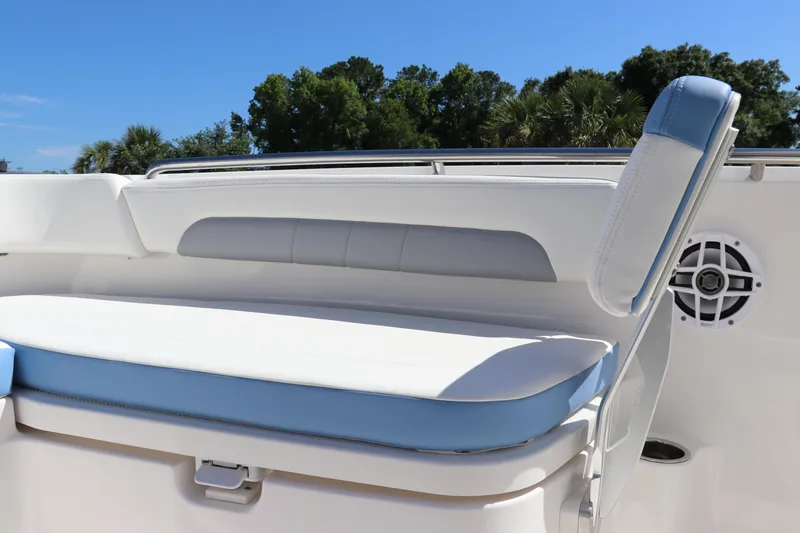 Slide: The Image of 2024 Robalo R202 EX boat seating with blue and white upholstery. - 15
