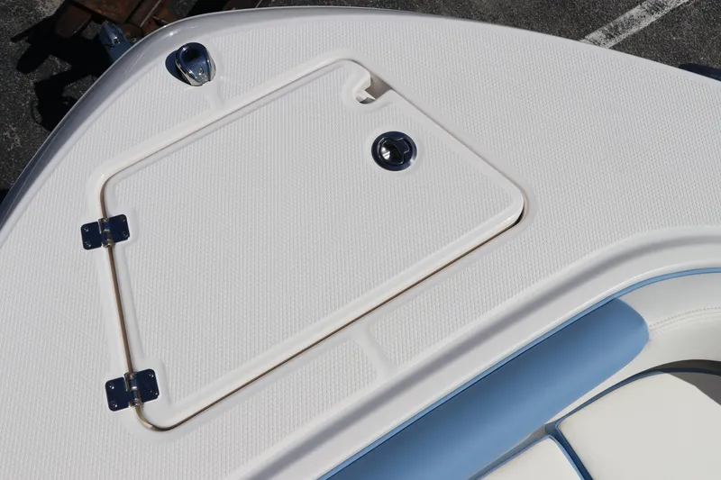 Slide: The Image of 2024 Robalo R202 EX boat deck with storage compartment. - 17