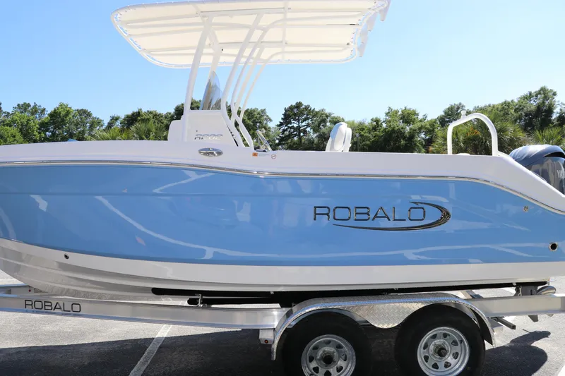 Slide: The Image of 2024 Robalo R202 EX boat on a trailer, side view. - 3