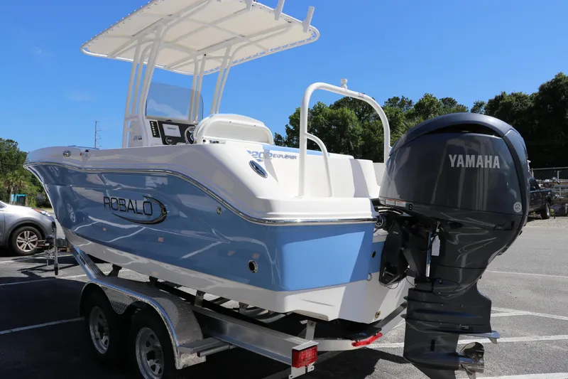 Slide: The Image of 2024 Robalo R202 EX boat with Yamaha outboard motor on trailer. - 6