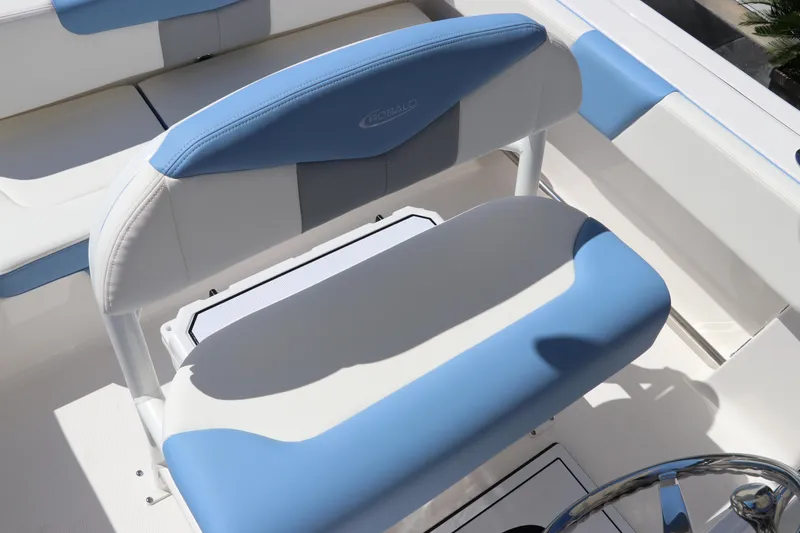 Slide: The Image of 2024 Robalo R202 EX boat seating with blue and white upholstery. - 9