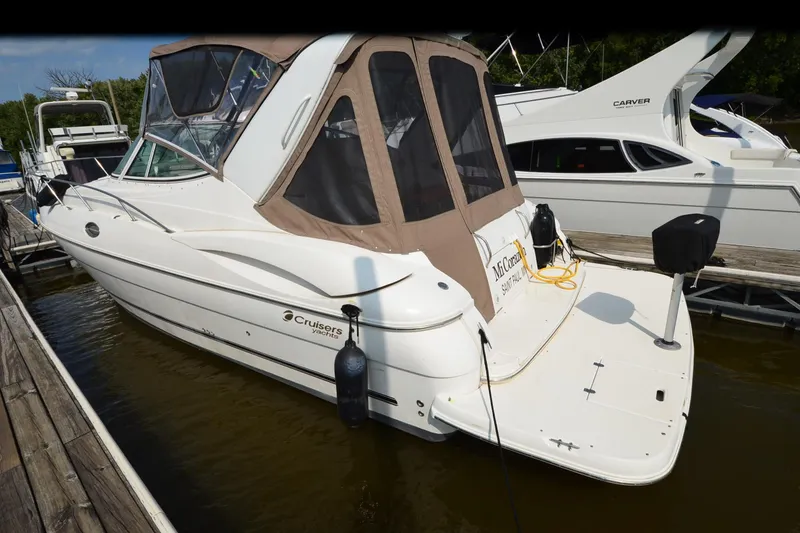 Slide: The Image of 2004 Cruisers Yachts 320 Express docked at marina, rear view. - 4