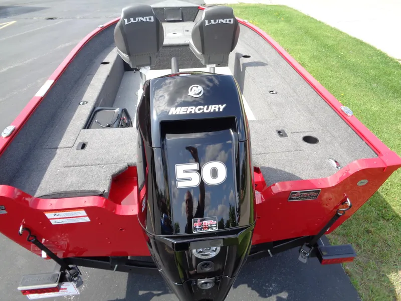 Slide: The Image of 2024 Lund 1650 Angler boat with Mercury 50 engine, red exterior, and dual seats. - 9
