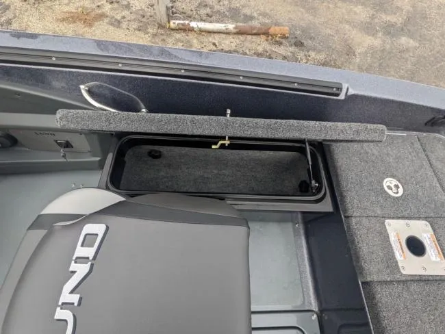 Slide: The Image of 2025 Lund 219 Pro-V GL boat interior storage compartment and seating. - 10