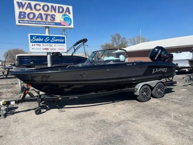 Slide: The Image of 2025 Lund 219 Pro-V GL boat on trailer at Waconda Boats dealership. - 3