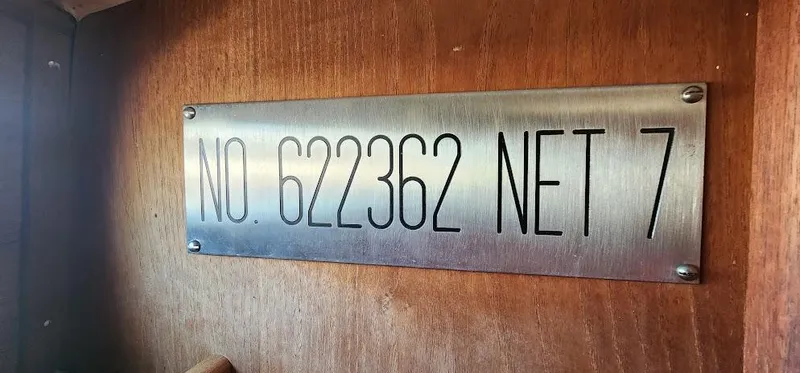 Slide: The Image of Plaque on 1980 Cape Dory 30 boat displaying number 622362 and net 7. - 14