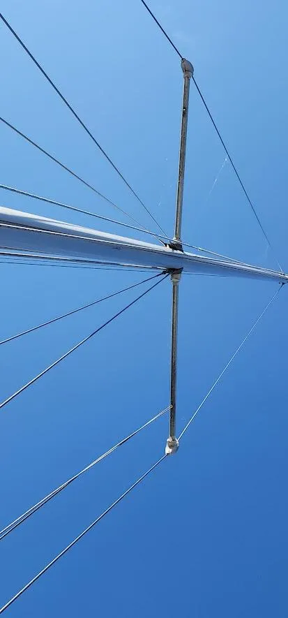 Slide: The Image of Mast and rigging of a 1980 Cape Dory 30 sailboat against a clear blue sky. - 39