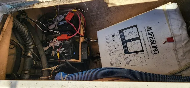 Slide: The Image of Interior of a 1980 Cape Dory 30 showing equipment and a Lifesling safety device. - 44