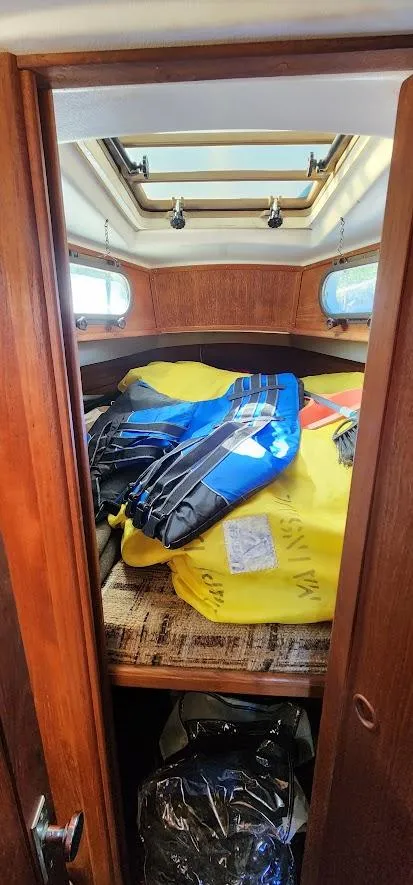 Slide: The Image of 1980 Cape Dory 30 sailboat cabin with storage and gear. - 7