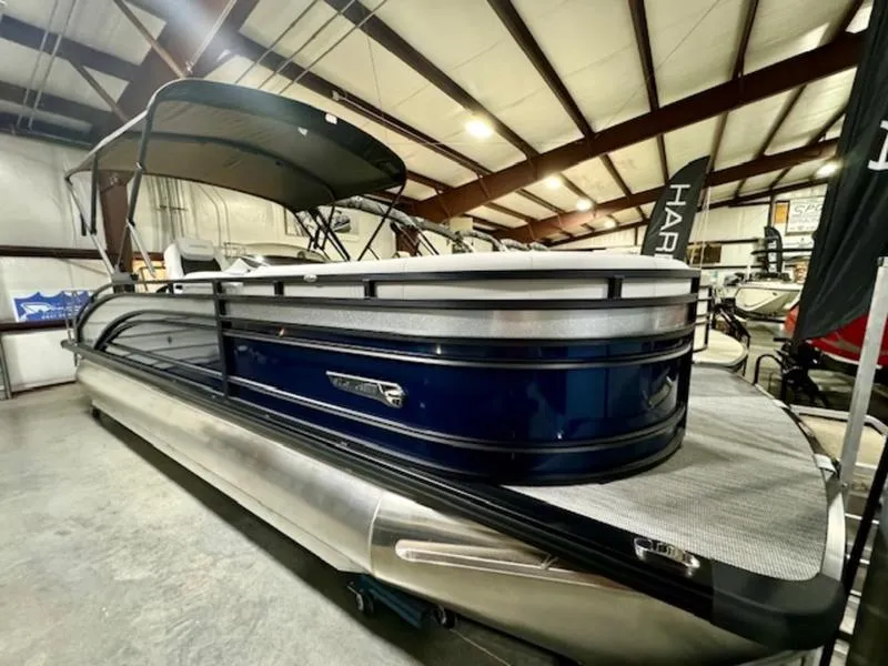 The Image of 2024 Harris Solstice 230 SLDH pontoon boat in showroom. - 1
