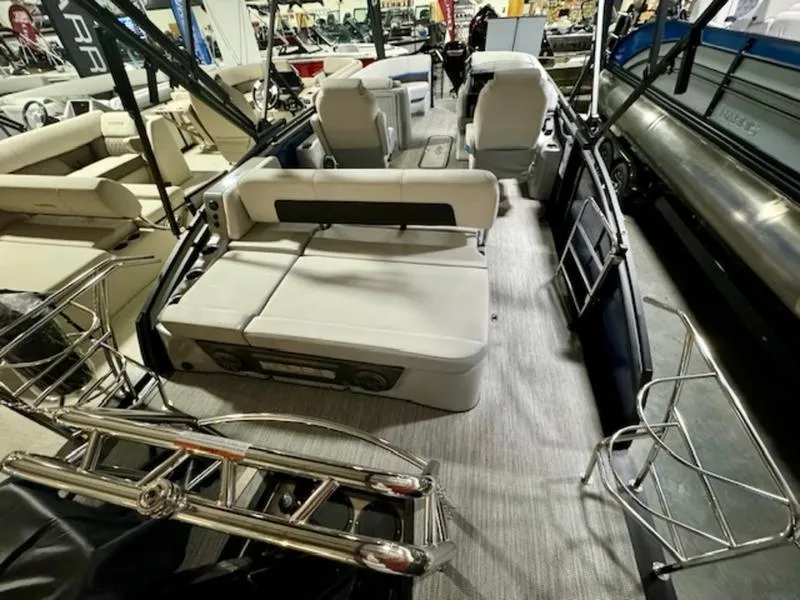 Slide: The Image of 2024 Harris Solstice 230 SLDH pontoon boat interior with luxurious seating. - 10