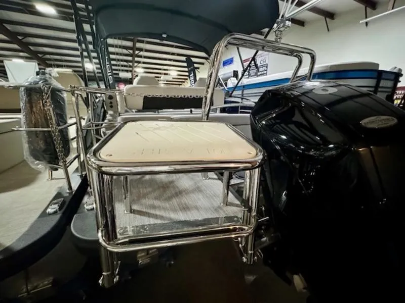 Slide: The Image of 2024 Harris Solstice 230 SLDH boat interior with chrome details and seating. - 14