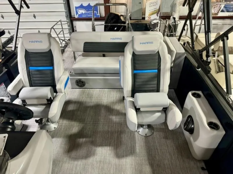 Slide: The Image of 2024 Harris Solstice 230 SLDH boat interior with white and black seating. - 6