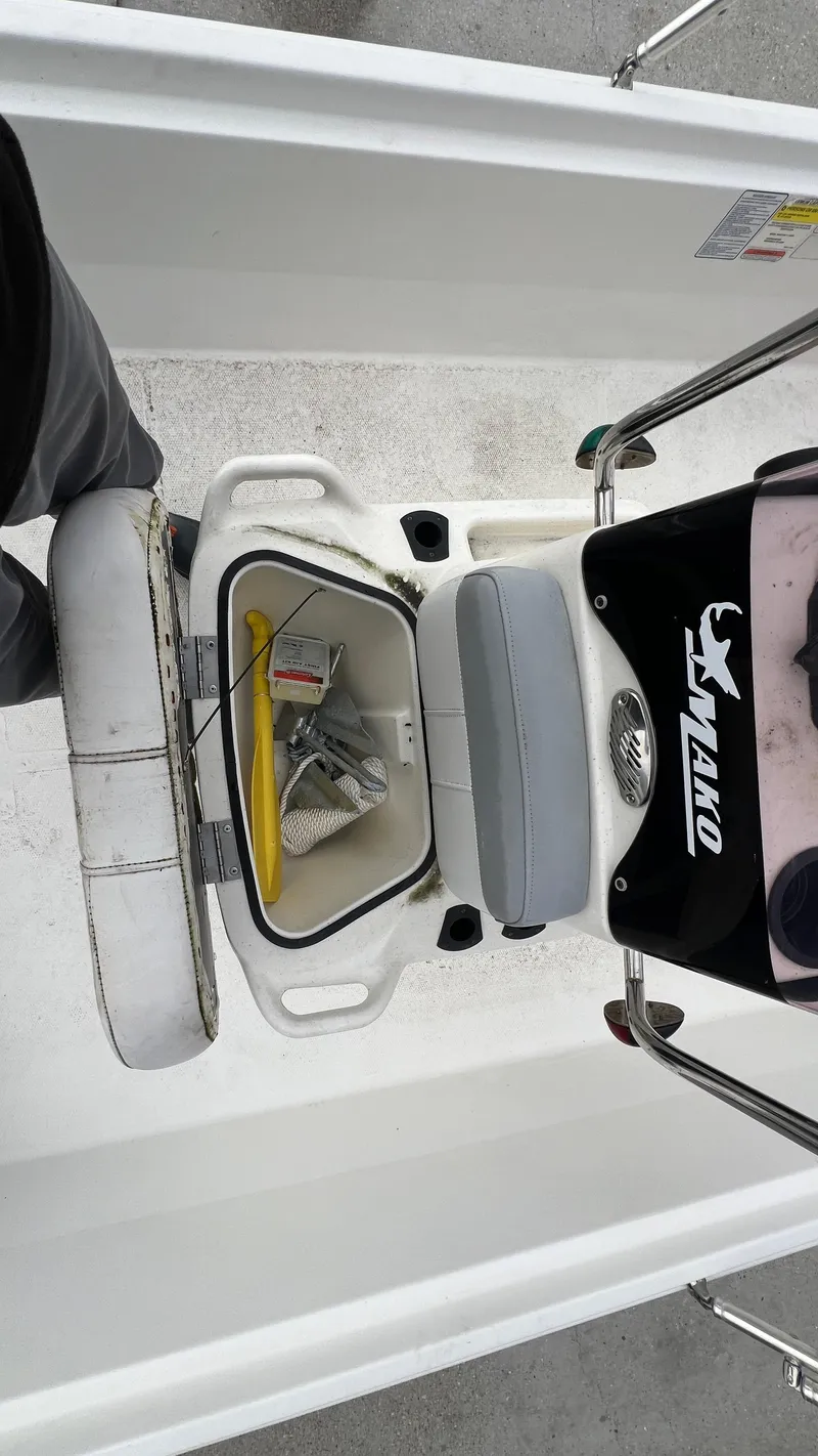Slide: The Image of 2018 Mako Pro Skiff 17 CC center console with storage compartment. - 14