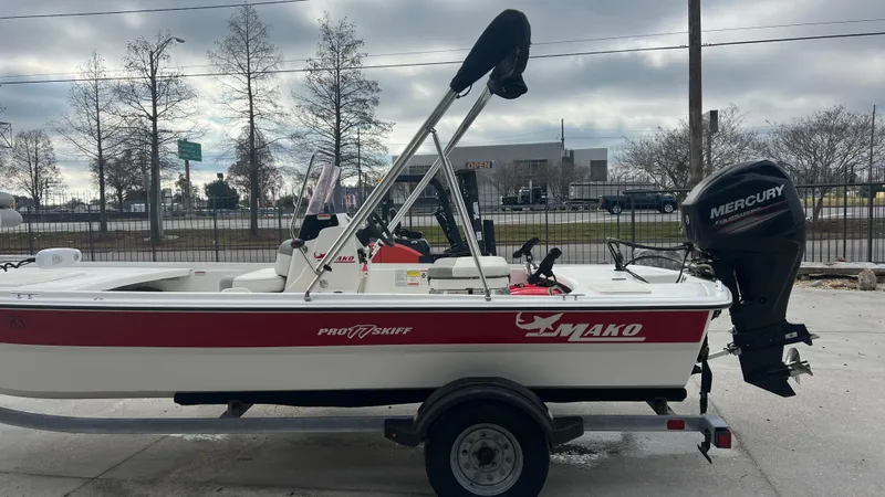 Slide: The Image of 2018 Mako Pro Skiff 17 CC boat with Mercury outboard motor on trailer. - 8
