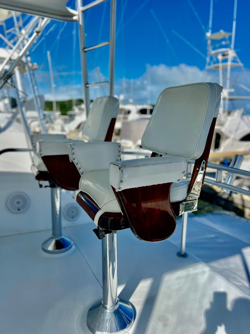 Slide: The Image of Captain's chairs on the deck of a 1997 Viking 43 Convertible yacht. - 27
