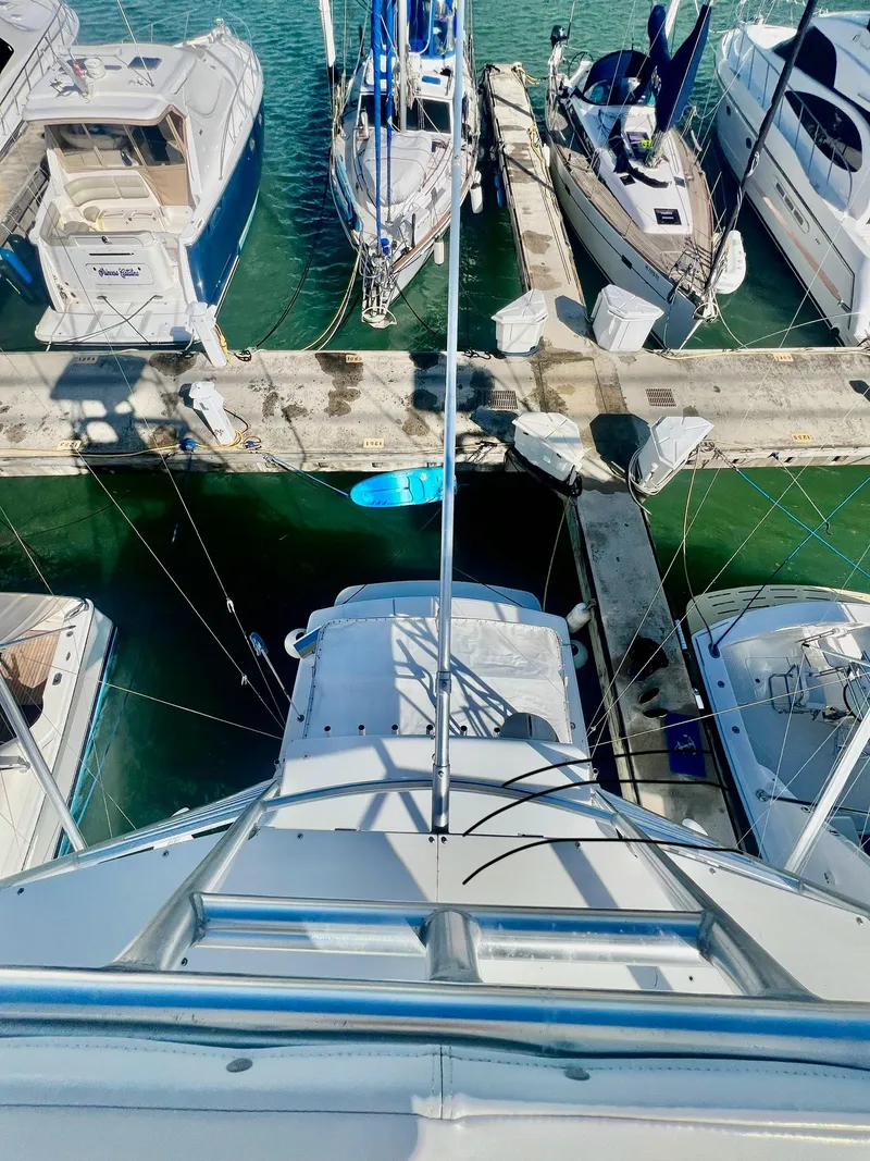 Slide: The Image of Aerial view of a 1997 Viking 43 Convertible yacht docked at a marina. - 29