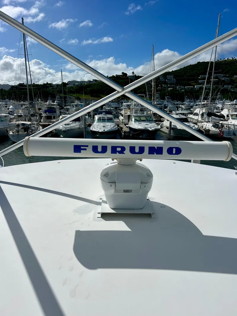 Slide: The Image of Radar equipment on a 1997 Viking 43 Convertible yacht docked at a marina. - 32