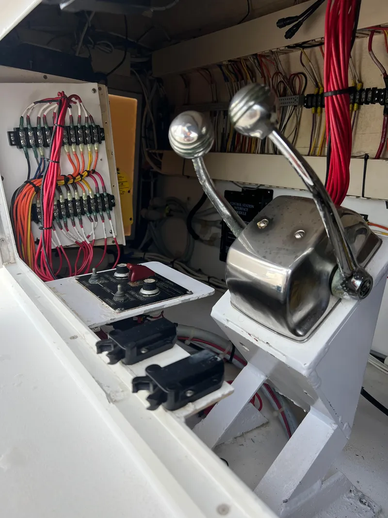 Slide: The Image of Control panel and wiring inside a 1997 Viking 43 Convertible boat. - 33