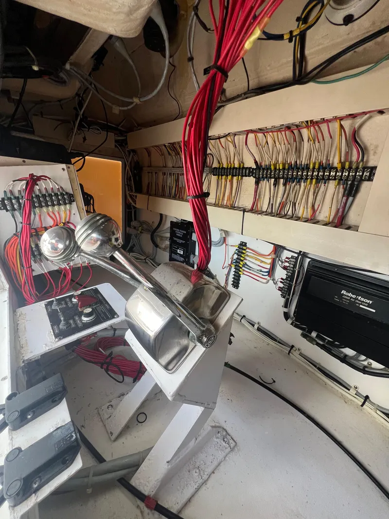 Slide: The Image of Electrical wiring and control panel inside a 1997 Viking 43 Convertible boat. - 35