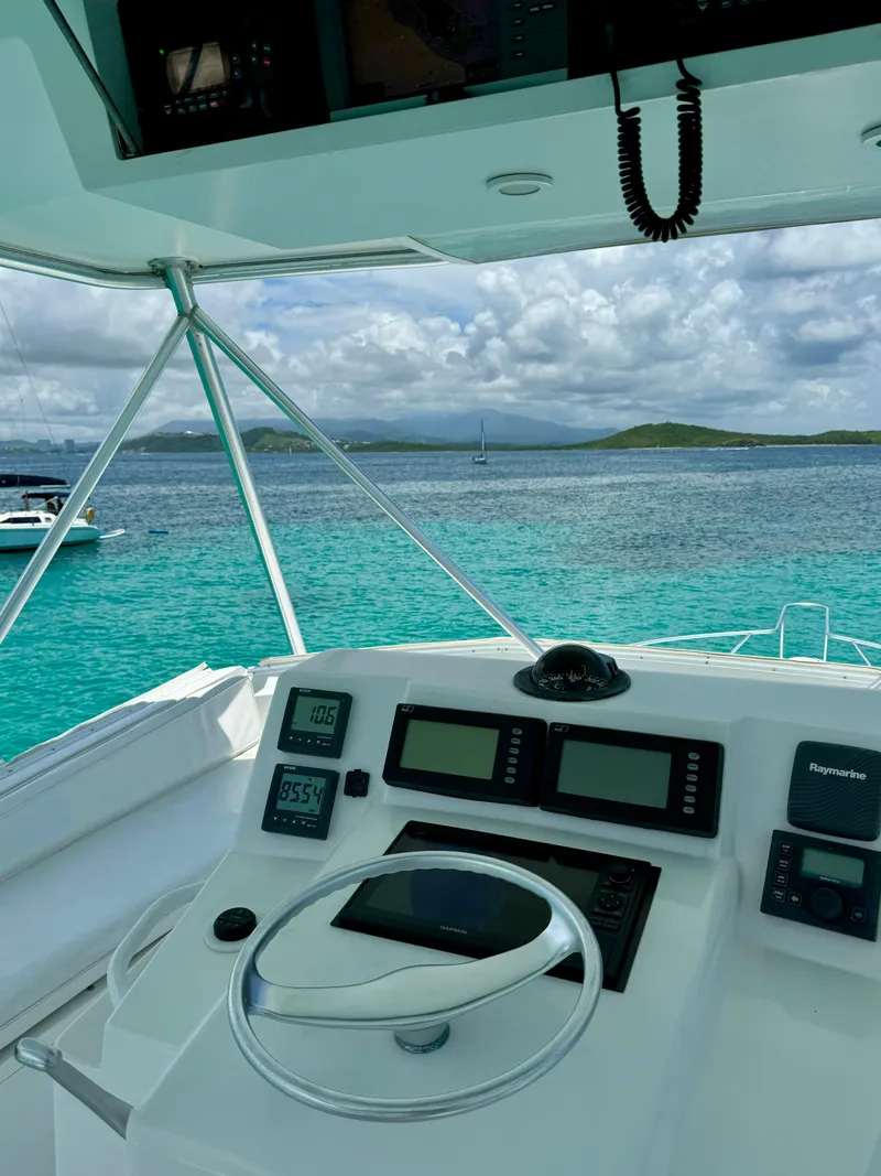Slide: The Image of Cockpit view of 1997 Viking 43 Convertible yacht with ocean backdrop. - 4