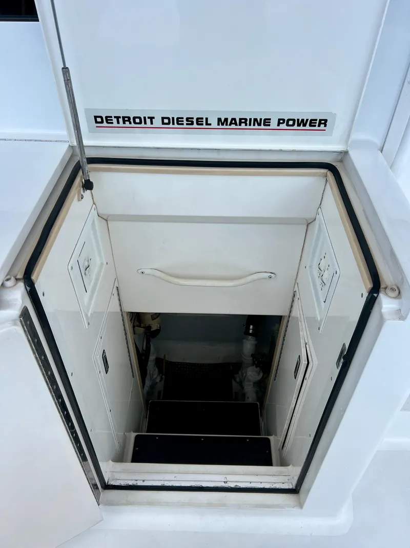 Slide: The Image of Engine room access hatch on a 1997 Viking 43 Convertible with Detroit Diesel Marine Power. - 45