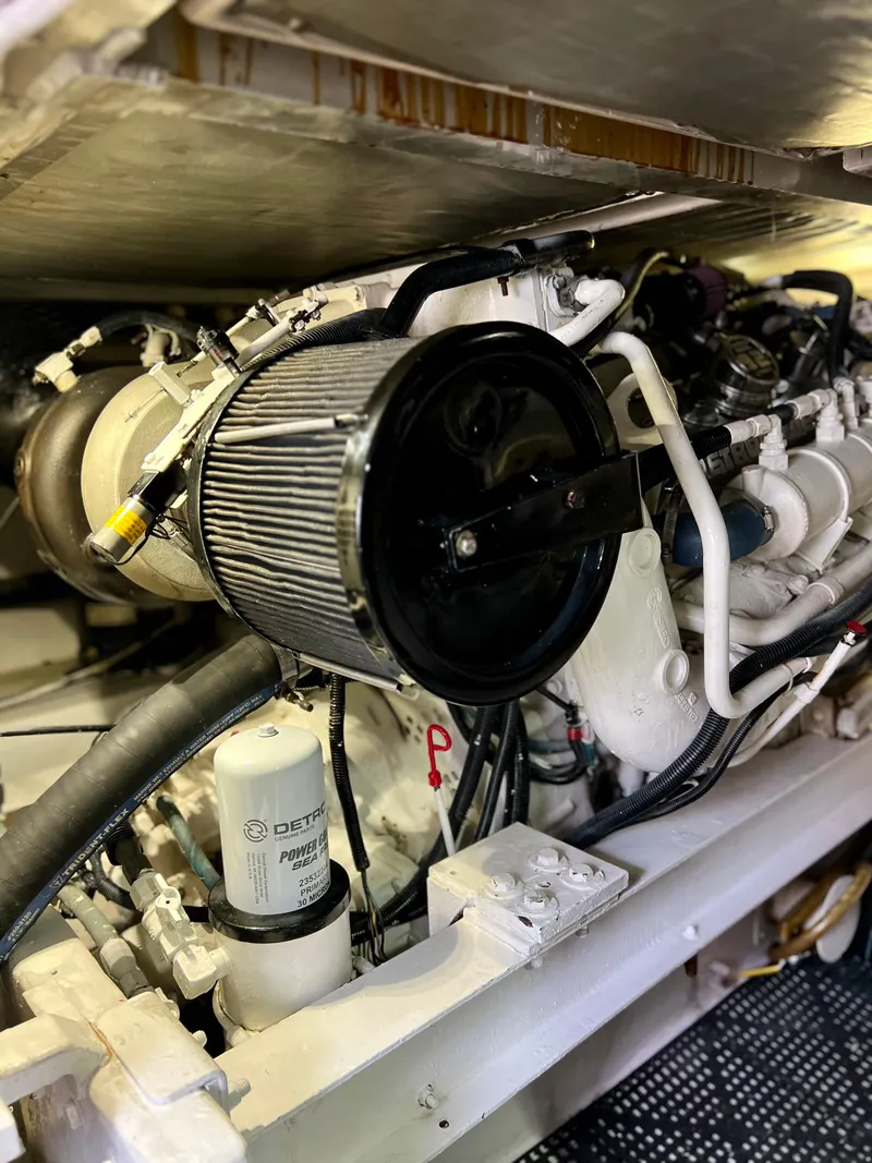 Slide: The Image of Engine compartment of a 1997 Viking 43 Convertible yacht, showcasing detailed components. - 48