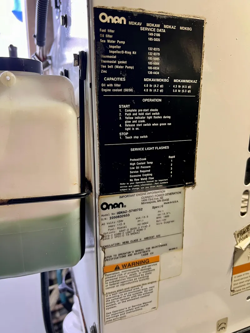 Slide: The Image of Onan generator service data and specifications on a 1997 Viking 43 Convertible. - 50