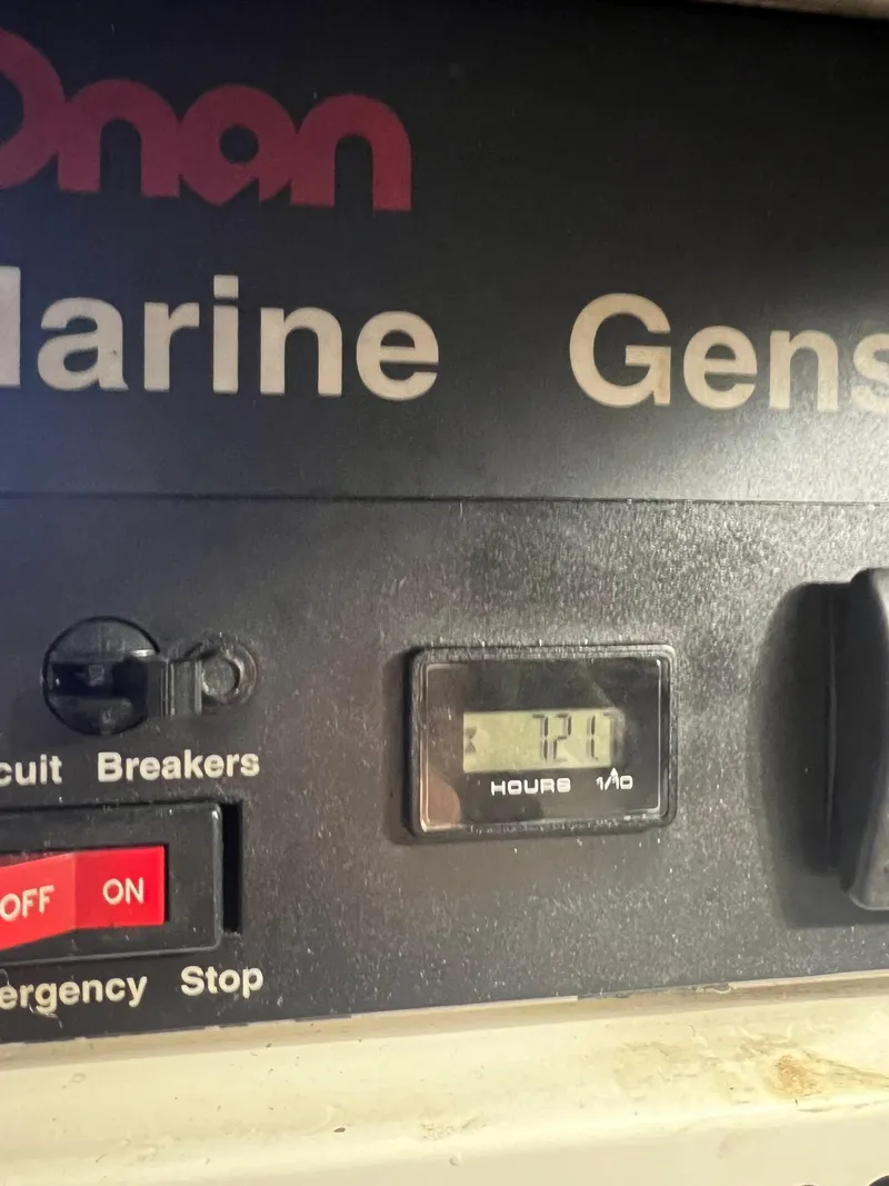 Slide: The Image of Onan marine generator control panel on a 1997 Viking 43 Convertible boat. - 51