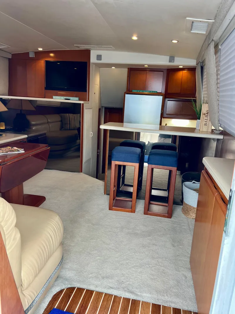 Slide: The Image of Interior of a 1997 Viking 43 Convertible yacht with modern furnishings. - 53