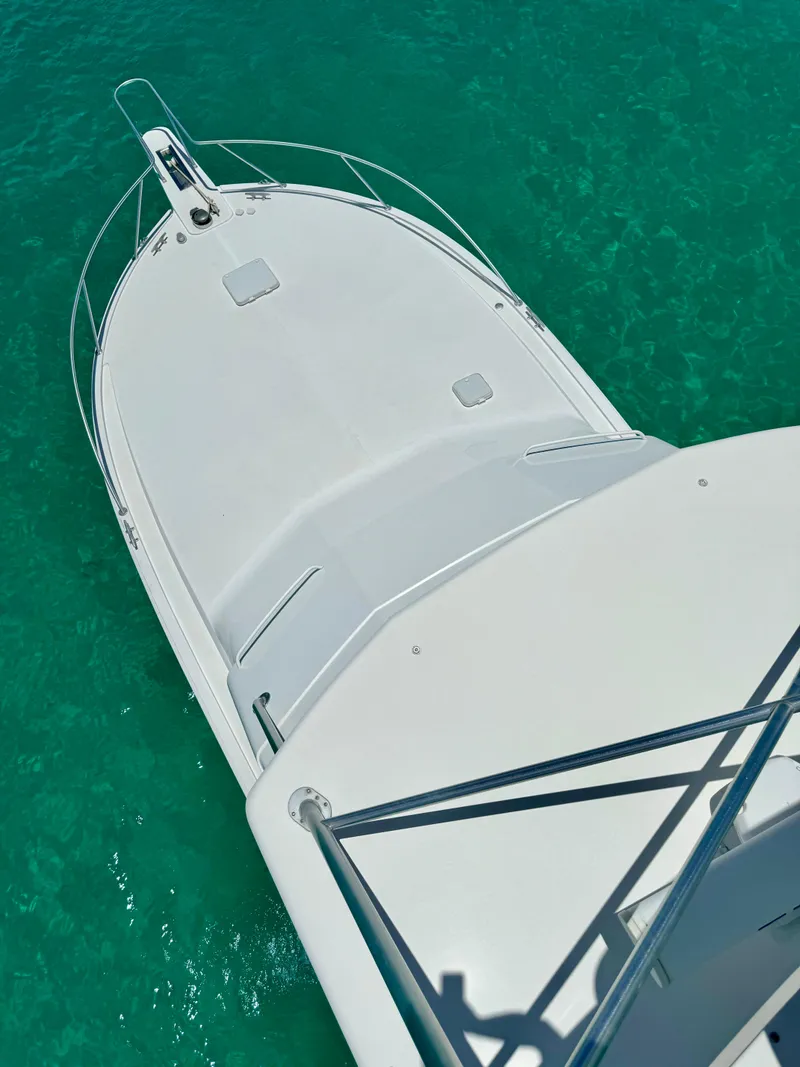 Slide: The Image of Aerial view of 1997 Viking 43 Convertible yacht on turquoise water. - 6
